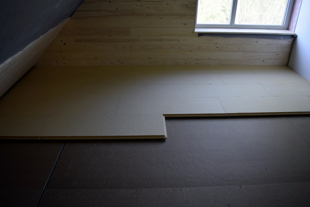 Isolation plancher — double couche fibre de bois croisée